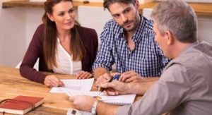 Dad discussing a loan with adult children