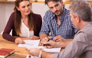 Dad discussing a loan with adult children